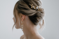A bride wearing her hair in a modern, relaxed updo for her wedding day in London. 