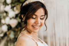 A bride wearing a glowing, natural makeup look for her wedding day at Cressing Temple Barns.